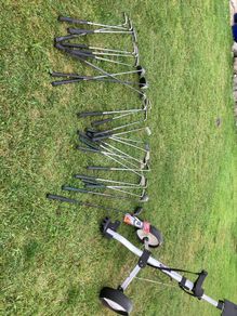 golf trolley and 2 sets of clubs