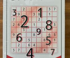 Sudoku game in sealed tin box