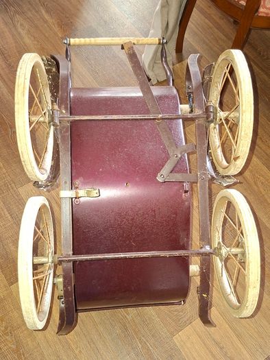 Antique Burgundy Doll's Pram, Manufactured by Walker around the 1940s, It features a Coach-Built Style Carriage with distinctive Wire-Spoke Wheels and Hard Rubber Tires Collection Only
