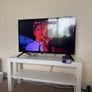 TV with Roku and Console Table Image 2