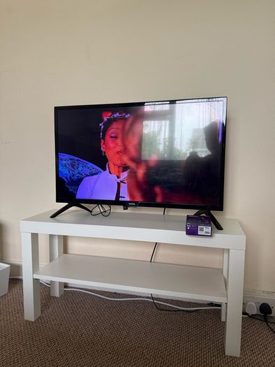 TV with Roku and Console Table