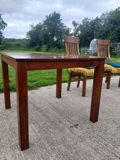 solid teak table and chairs