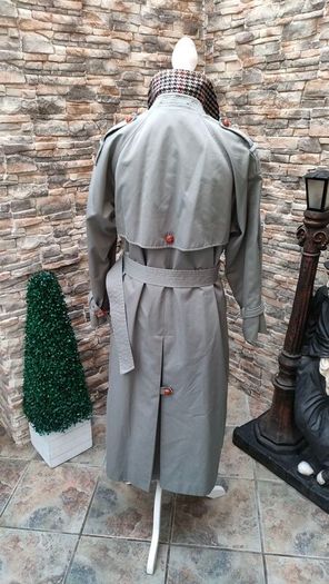 Vintage Nuage ladies trenchcoat Approximately late 90s early 00s Size 10 on label The colour is a pale bluey grey with brown buttons It's got an inner lining that can be removed