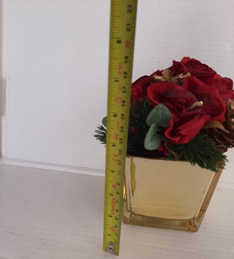 New artificial flower arrangement in vase tag attached