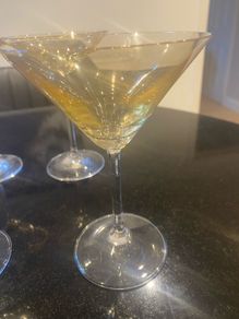 Set of four amber and plain glass martini or cocktail glasses
