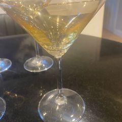 Set of four amber and plain glass martini or cocktail glasses