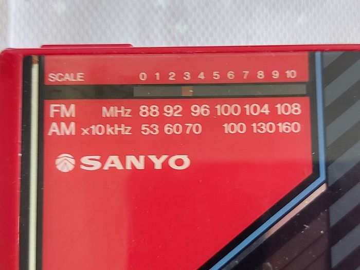 Sony Walkman and Sanyo AM-FM Stereo cassette Player, excellent cosmetic condition, no cables or batteries