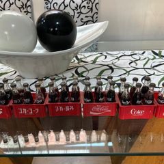Vintage 1980s Coca-Cola Mini Bottle Collection with Original Crates