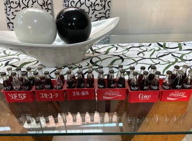 Vintage 1980s Coca-Cola Mini Bottle Collection with Original Crates