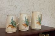 Charming vintage graduated set of three ceramic jugs