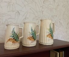 Charming vintage graduated set of three ceramic jugs