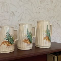 Charming vintage graduated set of three ceramic jugs