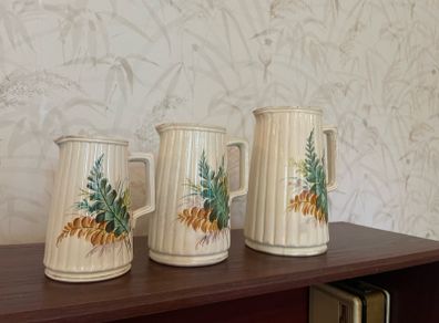 Charming vintage graduated set of three ceramic jugs