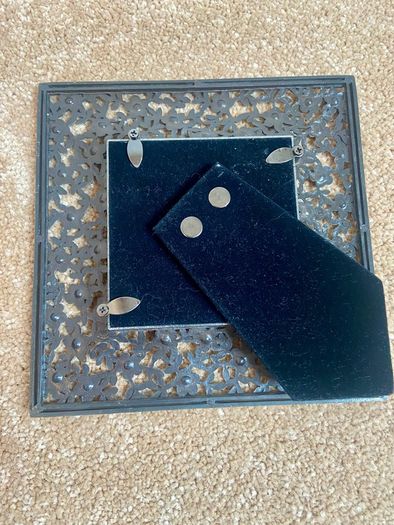 Small metal picture frame with flower detail