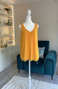 Brand-new orange sleeveless Ladies Top from Dunnes Stores