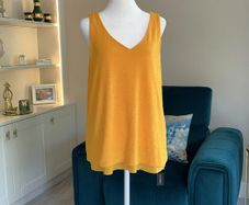 Brand-new orange sleeveless Ladies Top from Dunnes Stores
