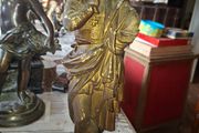 Antique Sculpture a gilt-bronze cast-metal Spanish Conquistador. On his torso is a Cross Pattee, a historical motif commonly associated with Christian military orders and medieval heraldry