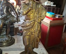 Antique Sculpture a gilt-bronze cast-metal Spanish Conquistador. On his torso is a Cross Pattee, a historical motif commonly associated with Christian military orders and medieval heraldry