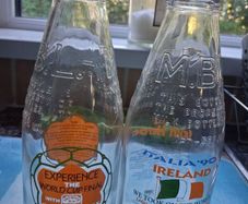 Two Italia 90 milk bottles