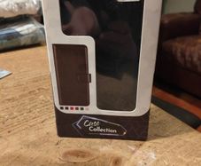 Black Multi functional phone case.  New in box.