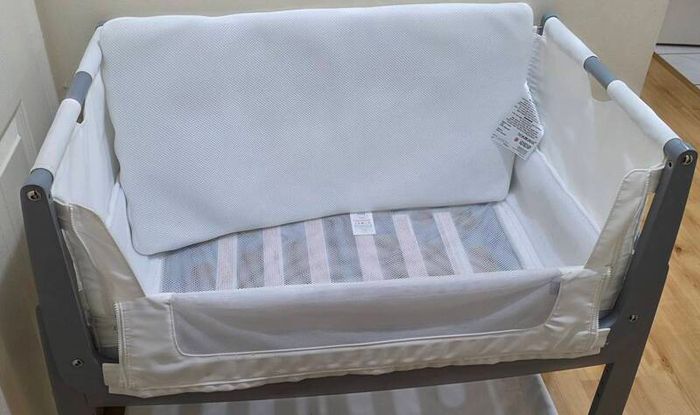 Dark gray bed side cot.