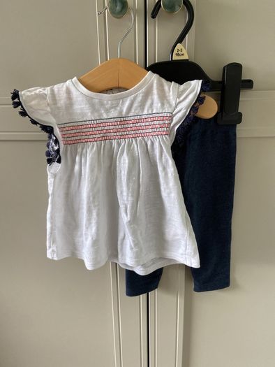2 piece baby outfit navy leggings white top with neon orange thread detail & navy fringing on capped sleeves