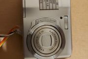 Z880 Digital Camera, Takes 2AA Batteries, working fine, has a modification that doesn't affect its performance