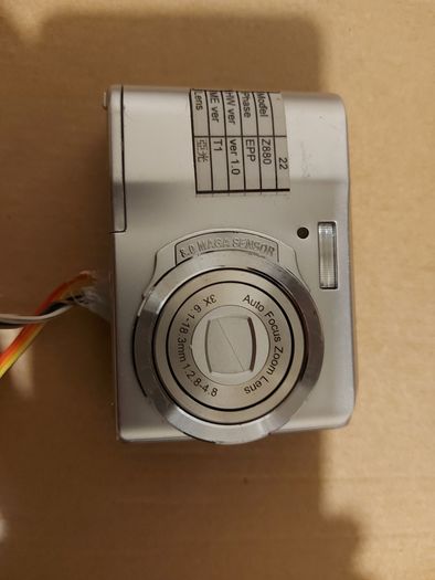 Z880 Digital Camera, Takes 2AA Batteries, working fine, has a modification that doesn't affect its performance