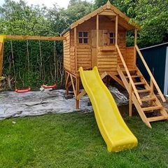Brand new Wooden treehouse slide and swings
