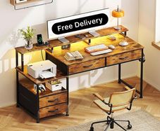 135cm Computer Desk with Power Outlet and Charging Station, Reversible Home Office Desk with Fabric Drawers and Monitor Stand, Wooden Desks with Storage, Study Table, Rustic Brown