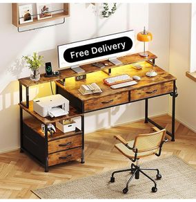 135cm Computer Desk with Power Outlet and Charging Station, Reversible Home Office Desk with Fabric Drawers and Monitor Stand, Wooden Desks with Storage, Study Table, Rustic Brown