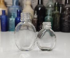 422 - Set of 2 Vintage Small Tabloid Collectible Decorative Bottles
