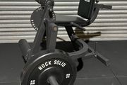 Leg Curl and Extension machine. Plate loaded