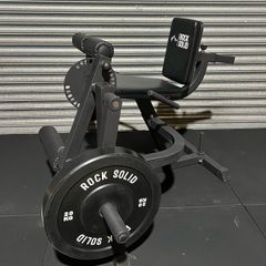 Leg Curl and Extension machine. Plate loaded