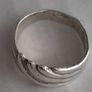 Silver ring clasping hands Image 2
