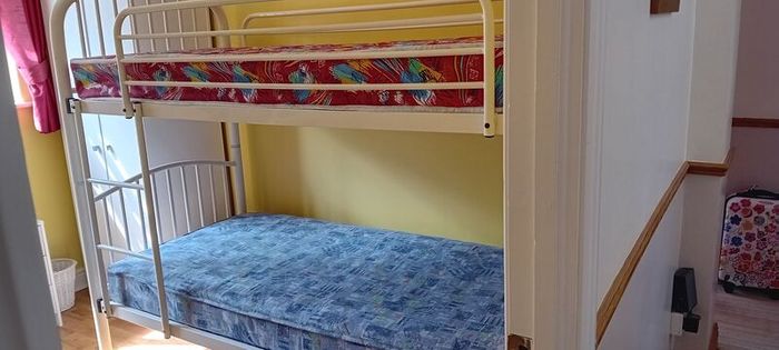 white metal bunk beds