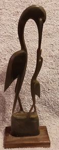 resin stork feeding young