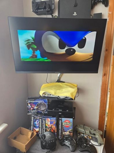 Sega Saturn w/ 3D Control Pad, Arcade Racer, Lightgun and Games