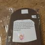 handcrafted wooden  Fairy door with red cardstock, brown flower cutouts, and decorative buttons.  various buttons acting as handles or embellishments. Image 5