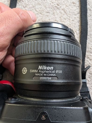 Nikon D7000 DSLR + Nikon 50mm f/1.8G + Tamron 18-200mm + Tripod + Camera Bag