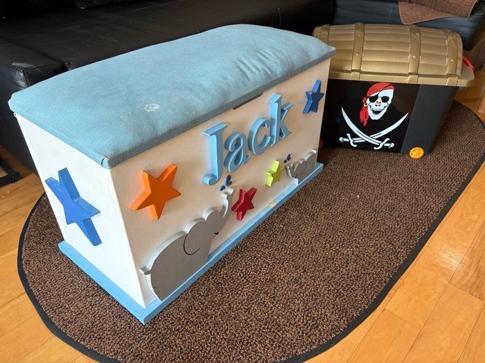 x2 Toy storage boxes Personalized white toy box features a light blue cushioned seat, the name "Jack" and pirate plastic box with lead