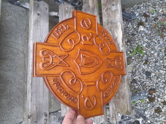 carved g.aa.a shield