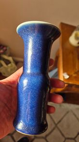 A blue glazed ceramic vase