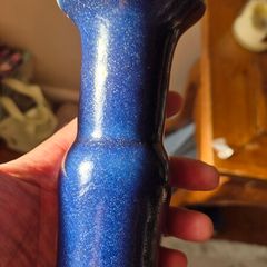 A blue glazed ceramic vase
