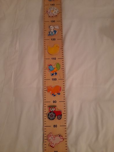 Wooden height rule/chart