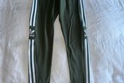 Adidas Women's Green Leggings with White Stripes - size UK 8