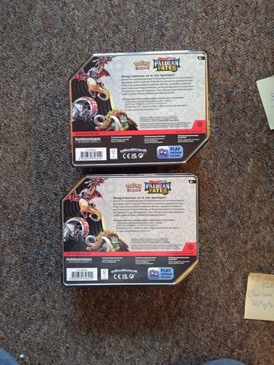 Pokemon TCG Scarlet and Violet Paldean Fates Charizard ex Tins