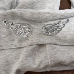 New flared pants with embroidered angel wings