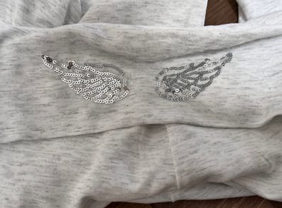 New flared pants with embroidered angel wings