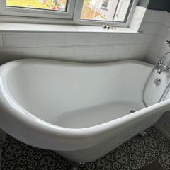 free standing bath with taps and and hose